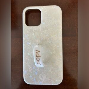 White pearl iridescent iPhone 12 loopy case with bag.
